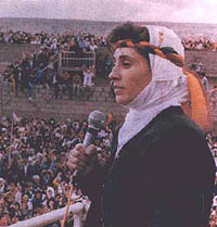 Former parliament member Leyla Zana speaks to Kurdish supporters. in The Back of the World